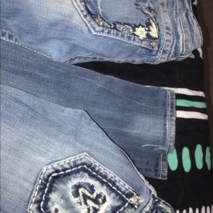 2 pairs size 24 and 25 miss me jeans